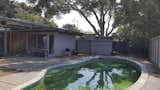 Before: The kidney-shaped pool was an original design element the homeowners wanted to retain.