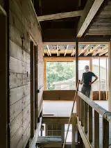 Before: The stairwell was circuitous and ate up a lot of floor space. It was also dark and made it difficult for daylight to reach the home's core.