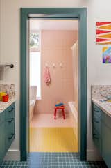 Bath Room, Two Piece Toilet, Ceramic Tile Floor, Ceramic Tile Wall, and Drop In Sink Ceramica Vogue tile in multiple colors brings a playful quality to the kids’ bathroom. The countertops are by Concrete Collaborative.