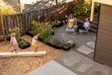 The updated backyard provides places to lounge and play.