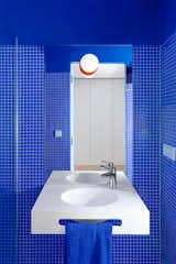 Now, the blue bathroom is one of the homeowners' favorite spaces. "We love showering in our blue cabin,