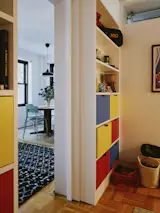 Inside Arthur's room, built-in storage helps make the most of a small footprint. The primary colors were inspired by Le Corbusier's Chandigarh.