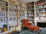 The Eames lounge chair is from Design Within Reach and is upholstered in Flamiber Cayenne fabric. The couch is by Floyd, and the rug is from ABC Carpet and Home.