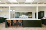 The counters are by Caesarstone and the backsplash tile is Fireclay. The appliances are from Fisher Paykel.  Photo 11 of 23 in Before & After: An L.A. Music Producer’s Latest Collab? Turning a Midcentury Into His Family Home