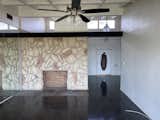<span style="font-family: Theinhardt, -apple-system, BlinkMacSystemFont, &quot;Segoe UI&quot;, Roboto, Oxygen-Sans, Ubuntu, Cantarell, &quot;Helvetica Neue&quot;, sans-serif;">They included a stone wall around the fireplace in the living room. <b>[what makes the stone fake? what kind of product is it?]</b></span>  Photo 4 of 23 in Before & After: An L.A. Music Producer’s Latest Collab? Turning a Midcentury Into His Family Home
