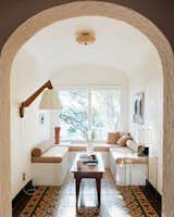 In this seating area off the main living room, Amanda designed a built-in seating area. "When we first moved into the house, I hung out in this space all the time,
