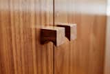 <span style="font-family: Theinhardt, -apple-system, BlinkMacSystemFont, &quot;Segoe UI&quot;, Roboto, Oxygen-Sans, Ubuntu, Cantarell, &quot;Helvetica Neue&quot;, sans-serif;">In the bathroom, walnut casework contains custom-designed pulls by Murray Legge Architecture.</span>