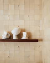 Amanda made all the tiles for the new kitchen backsplash. In total, she crafted more than 1,000 tiles in her studio. Amanda's ceramic sculptures are also placed around the home.