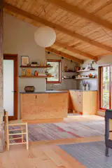 The kitchen cabinetry is marine plywood that was carefully grain matched, meaning the grain flows across the elevation of each door into a cohesive pattern. "All of the millwork is scribed and there is not a single bead of caulk in the whole project,