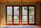 Nick rebuilt all the doors and windows from old growth Redwood. The door hardware is Baldwin mortise locksets.