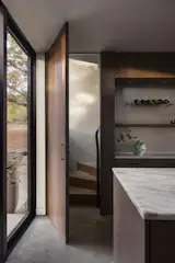 In the kitchen, one kintsugi detail marks a secret stairwell that leads to the guest suite. "It's a fun little moment because you open what looks like a cabinet and it's stairs leading to a bedroom,