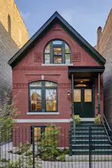 Working with local company Bricks Incorporated, the designers faithfully recreated the home's original brick facade, including custom-made decorative shapes to match the historic condition.