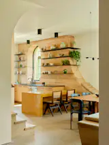 The home's rammed earth walls are featured mainly on the west-facing side, to regulate heat gain during warm days and maintain temperatures inside during chilly desert nights.