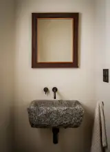 In the powder room, Smith snagged the vintage granite sink on Etsy. The mirror is vintage, sourced from <a href="http://www.luccaantiques.com">Lucca Antiques</a>.