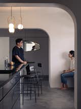 Kitchen, Concrete Floor, Metal Cabinet, Marble Counter, and Pendant Lighting  Photo 10 of 16 in Vignettes by Lam Jun Nan
