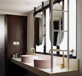 The vanity, originally inside the master bath, is position next to the wardrobe area and orientated to face the window. This allows the morning to sink in, as the couple kick starts their day at the sink.