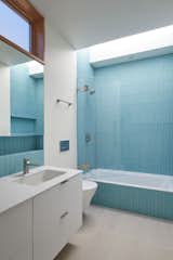 Bath Room, Alcove Tub, Concrete Floor, One Piece Toilet, and Ceramic Tile Wall Floor and wall tile is Heath Chalk Gunmetal  Photo 16 of 20 in Seventh Street Residence by Sidell Pakravan Architects