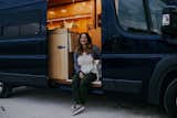 Kitchen, Drop In Sink, Refrigerator, Wood Counter, Wood Cabinet, Dark Hardwood Floor, Ceiling Lighting, and Wood Backsplashe Home owner, Laurén Ettinger and her pup Penny live and travel full time in their tiny home on wheels.  Photo 5 of 15 in The Pennybago by Laurén Ettinger