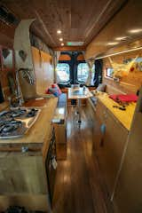 A hidden composting toilet as well as laundry and bathroom storage are underneath the right side butcher block counter top.