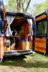 A drawer under the right bench seat can be accessed by pulling out or by lifting up the top of the bench. The van has an aluminum roof rack and a back ladder to allow roof access. 300w of solar are mounted on the roof as well as a wifi signal booster. The roof is an excellent place to watch the sunset.