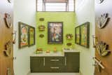 The theme of the interior has been inspired by that of a peacock and the interior elements such as the bookshelf, motifs, are a deconstructed manifestation of the idea itself.