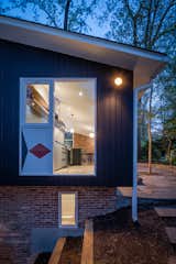 Exterior, Glass Siding Material, Mid-Century Building Type, Wood Siding Material, Shingles Roof Material, House Building Type, Gable RoofLine, Small Home Building Type, and Brick Siding Material  Photo 8 of 25 in College View Home by Cook Architecture