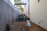 Patios. The project explores preconceived ideas of boundaries between neighboring semi-private spaces. Connected exterior areas promote community interaction.