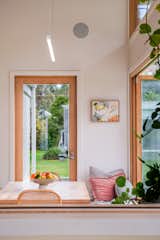 Bifold windows allow the deep blockwork plinth to be both an internal and external seat - connecting the inside and out.