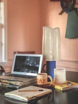 When working from home, ETC.etera cofounder Jake Rodehuth-Harrison places his laptop on a stack of books to help reduce neck strain. 