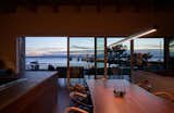 The post and beam construction of this Lindal Cedar Home allows for a 32 foot sliding door to the back deck and dining area.