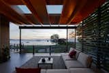 The indoor/outdooor entry room is further illuminated by two skylights.