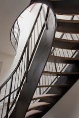 Staircase Curving steel stair  Photo 5 of 8 in Clinton Hill Townhouse by Neuhaus Design Architecture, PC