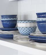 It's all in the details. From the dishes to the upholstery, Classic Blue is featured throughout this home.
