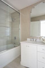 Shayla Copas chose to keep it neutral in the master bathroom to complement the bedroom's blues.