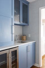 Sky Blue cabinets carry the color theme throughout this Arkansas Lake House.