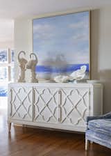 Large contemporary artwork repeats the hues as well as accessories within the room’s décor.