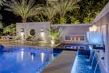 Tropical plantings finish the waterfront design by offering a resort-like ambiance to the exteriors from raised planters imbued with LED lighting.  In-pool and inter-planting lighting creates day to night enjoyment of the outdoor space. 