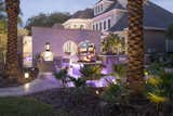 Incorporating architectural elements with fanciful fire and water features, an epic outdoor venue for enjoyment and entertainment resulted. 