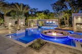 Additional lounging and deck areas, a spa and natural plantings accomplish a complete outdoor story. 