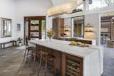 Main Kitchen Island with Marble Waterfall End and Custom Hubberton Forge Pendant
