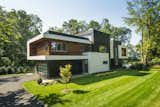 Exterior, Flat RoofLine, Wood Siding Material, Green Siding Material, Stucco Siding Material, and House Building Type Front Exterior  Photo 3 of 18 in Blue Coat Lane by Lucien Vita