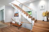 Staircase, Wood Tread, and Glass Railing Main Glass and Wood Stairs  Photo 16 of 18 in Blue Coat Lane by Lucien Vita