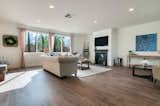 Living Room, Recessed Lighting, Sofa, Chair, Coffee Tables, Medium Hardwood Floor, Gas Burning Fireplace, Console Tables, Ceiling Lighting, and Bench  Photo 3 of 20 in The Kooden House by Alicia Fukuzawa