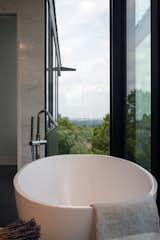 Freestanding bathtub with views of downtown