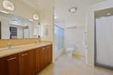 Master bath with double bowls,  tub/shower and shower stall.