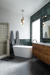 This 30"x30" porcelain tile floor could be mistaken for concrete with an exposed aggregate. It's so earthy and industrial.