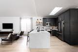 The first view as soon as you walk into the house. This waterfall quartz countertop steals the show.