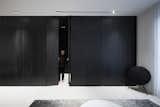 the black wooden plank doors from vestibule to living room