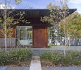Exterior, Metal Siding Material, Hipped RoofLine, Metal Roof Material, Wood Siding Material, and House Building Type  Photo 5 of 12 in Champlain Modern by Birdseye