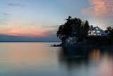 Exterior, Curved RoofLine, Wood Siding Material, Metal Roof Material, House Building Type, and Gable RoofLine  Photo 3 of 7 in Sunset Cliff by Birdseye